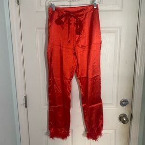 Red satin pants feather ankle trim